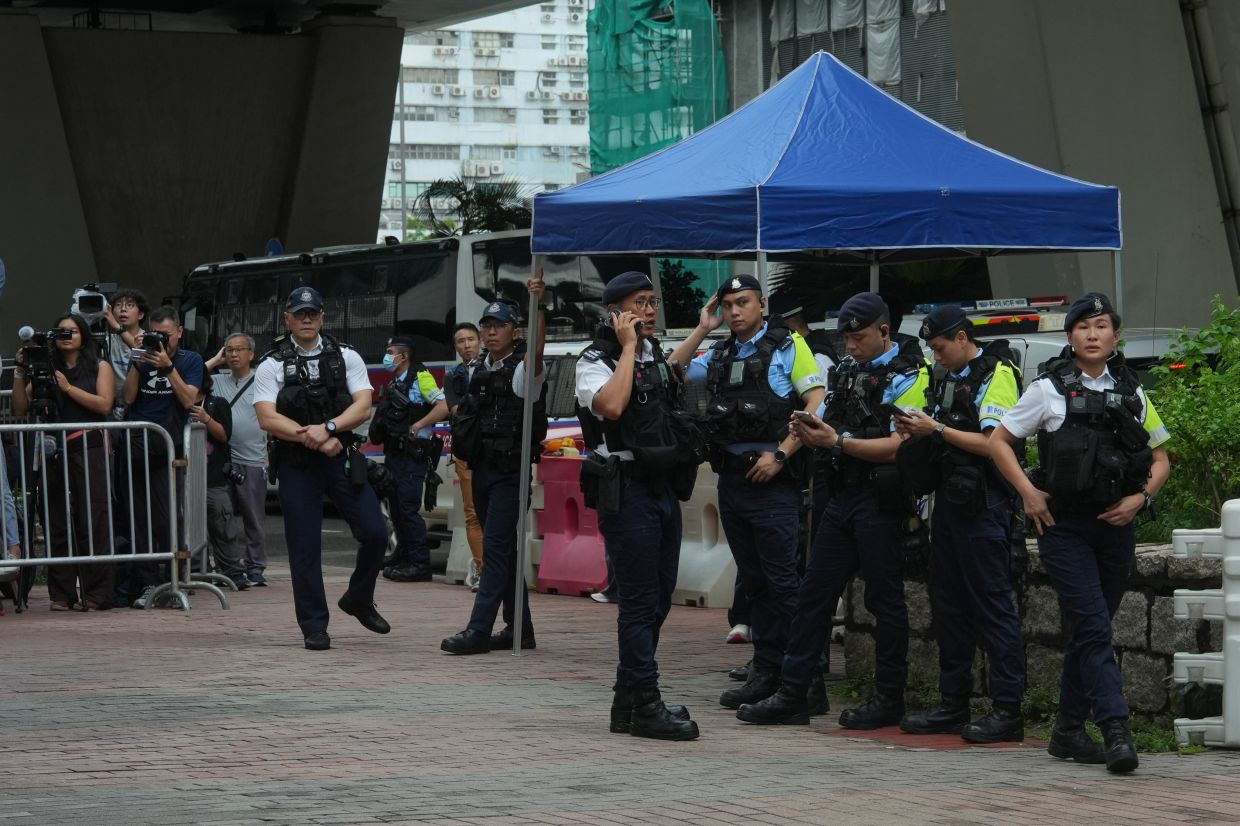 Hong Kong Woman Arrested for Seditious T-Shirt as Democracy Trial Concludes