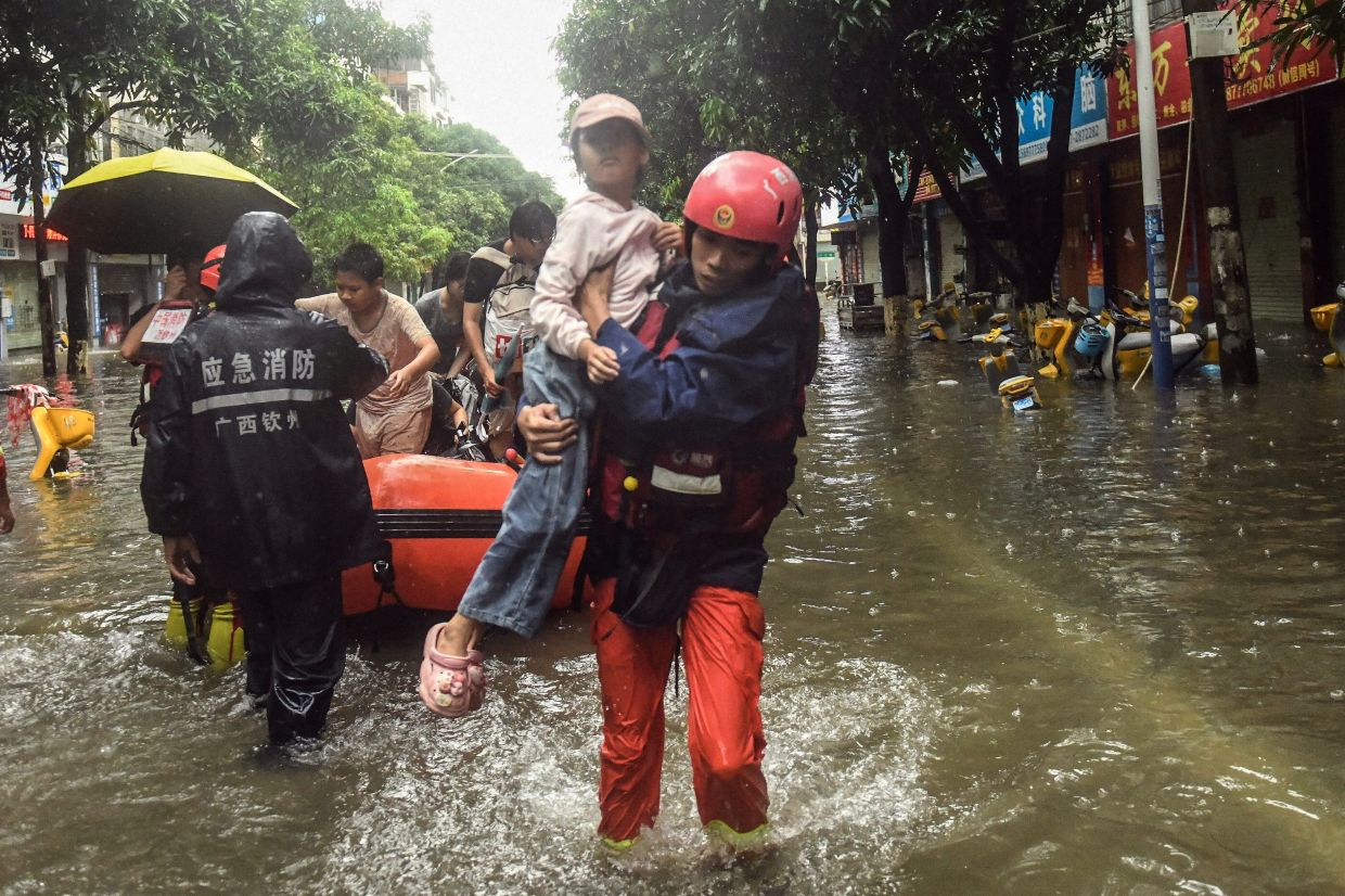 China battles multiple natural disasters as storms kill dozens and displace thousands