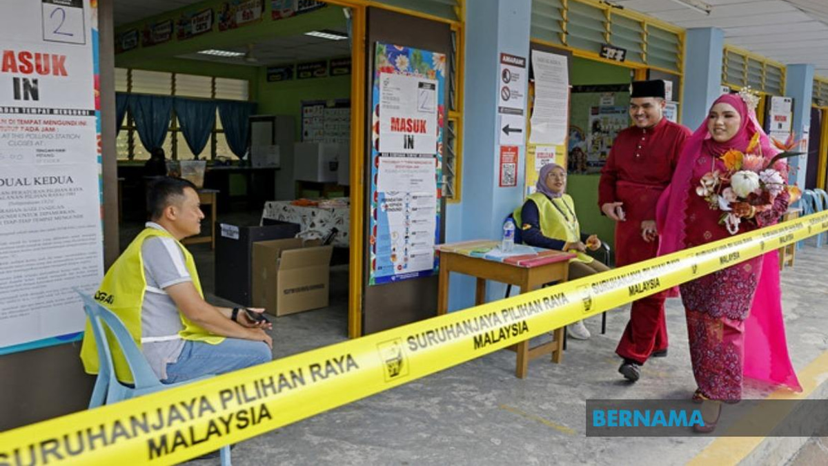 Bride Casts Vote in Wedding Finery at Negeri Sembilan Election