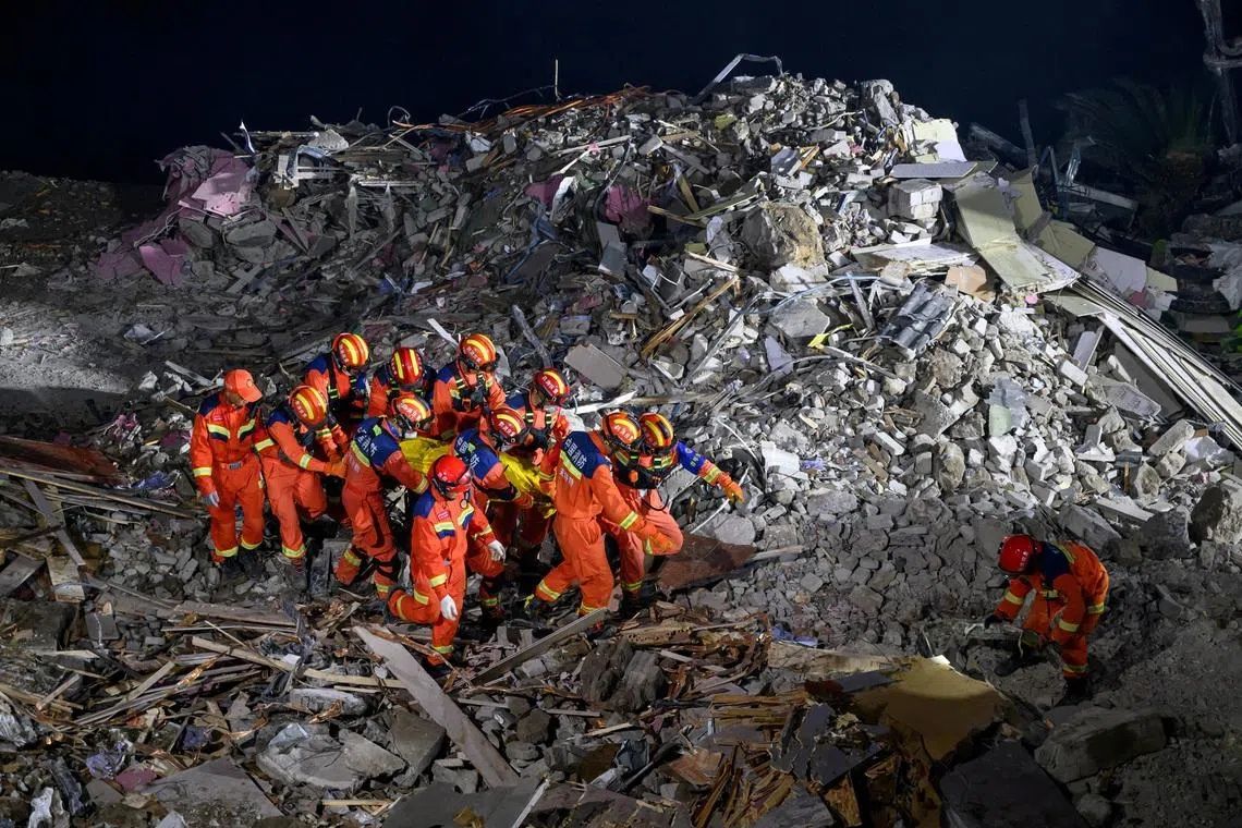 Chinese rescue teams blast through boulders to reach 34 missing after landslide