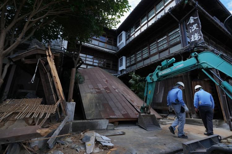 Heat and hardship compound Japan's earthquake crisis as death toll rises to 36